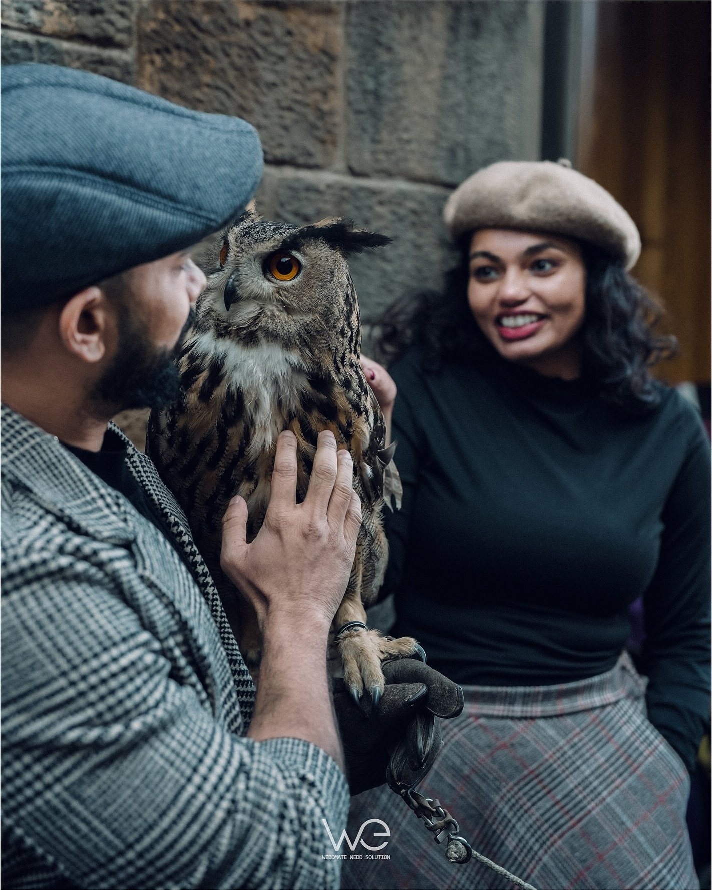 A couple sharing a falconry experience outdoors